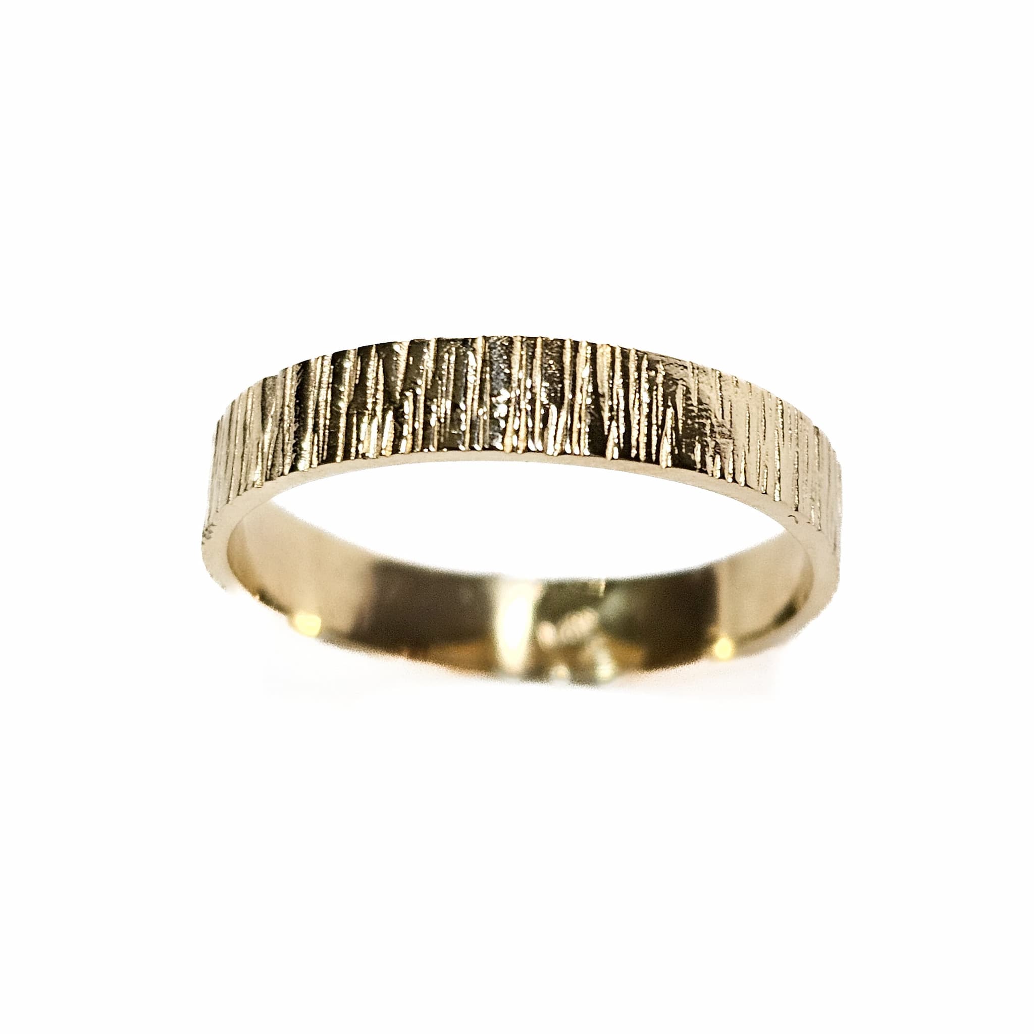 14k gold band ring top view with vertical textured finish on white background

